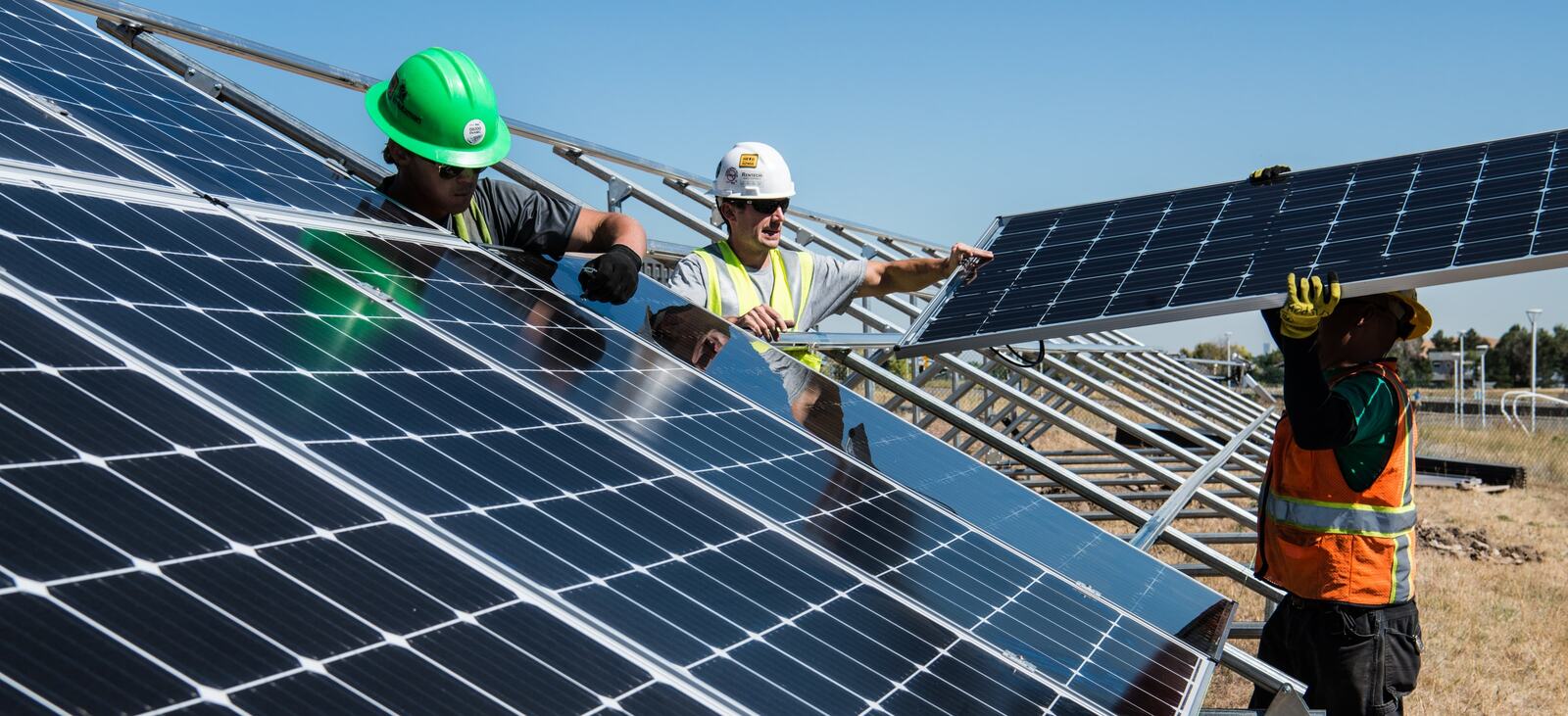 Technicians installing solar panels